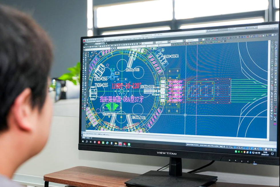 FURI engineering team developing a non-standard cap assembly machine